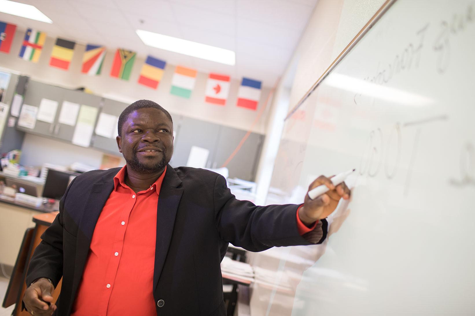 Adolph Dagan poses for photo at Rossview High School classroom